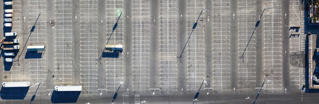 aerial view of parking with trucks