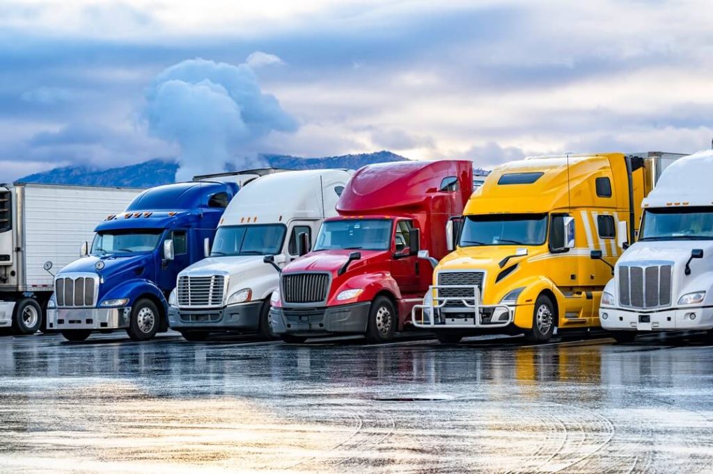 big rigs parked next to each other