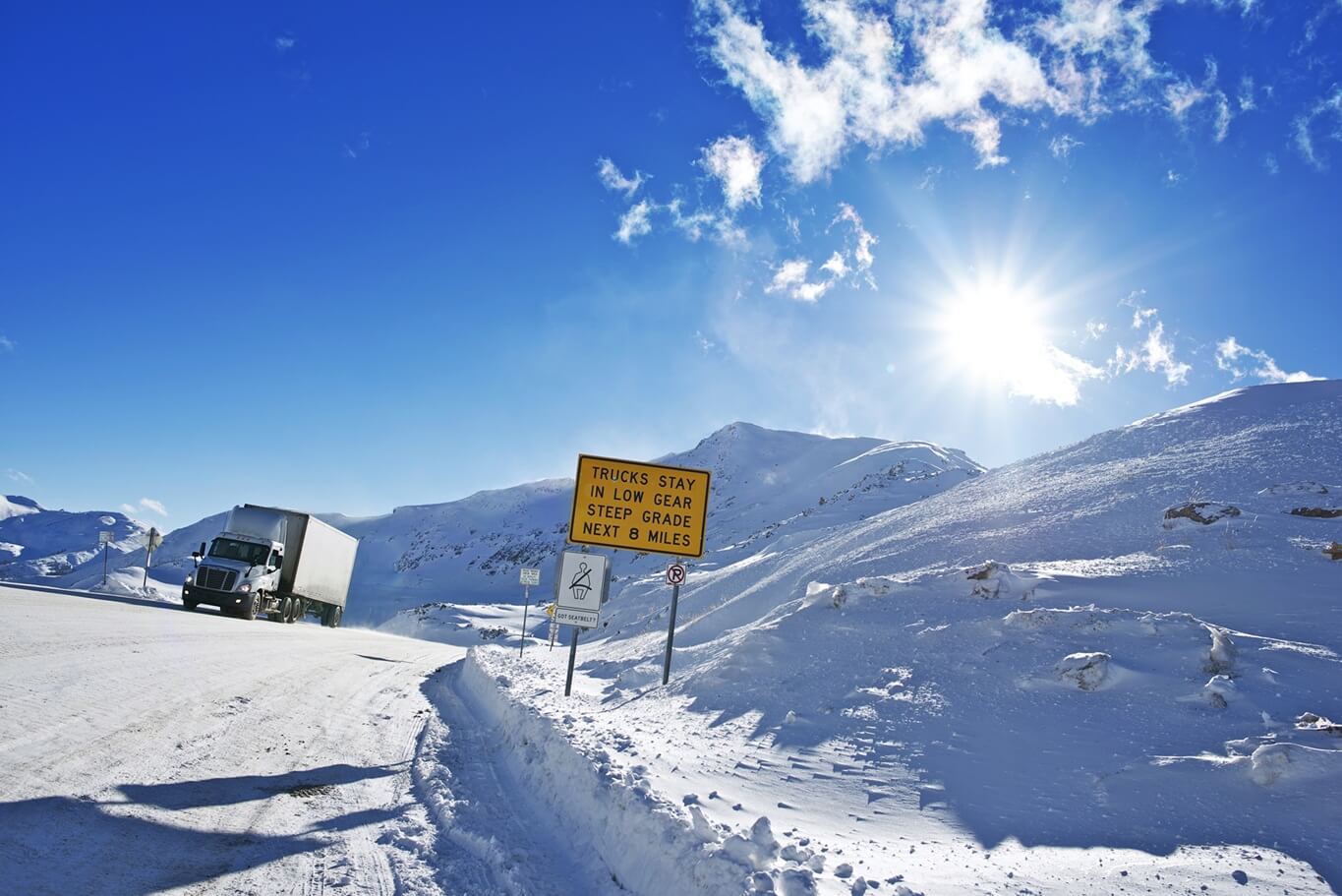 truck on a dangerous mountain road in snow