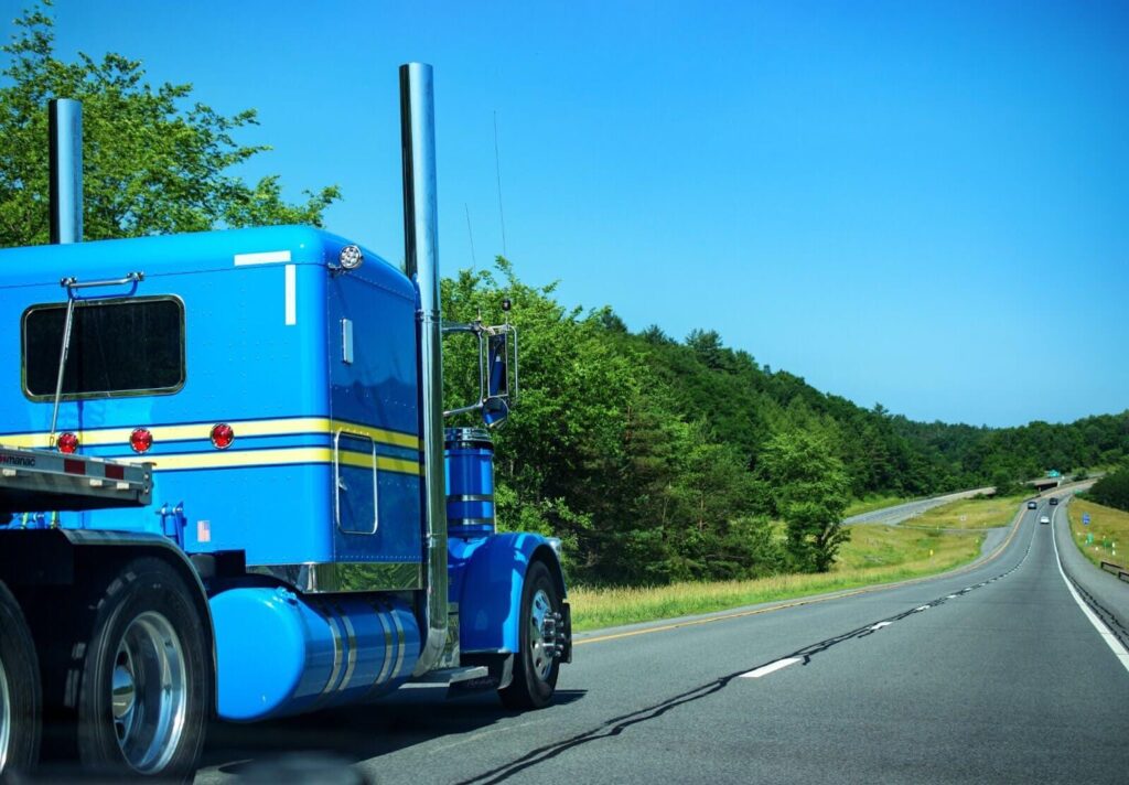 blue truck on the road