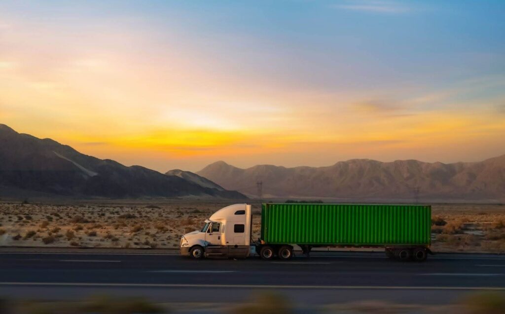 truck on the highway as the sun sets
