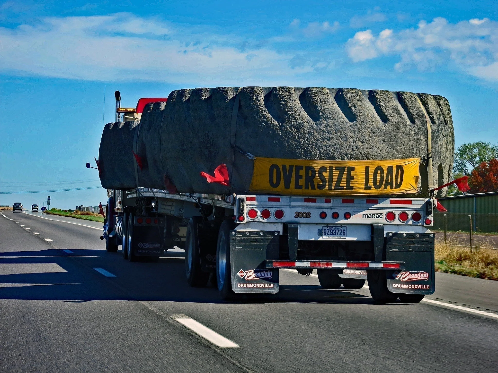 Heavy haul truck hauling an oversize load on a permitted route